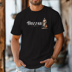 Black T-shirt featuring a Renaissance Faire design with the word “Huzzah” in medieval-style lettering and an illustration of a knight in shining armor. Perfect for Renaissance fair goers, medieval enthusiasts, and fans of historical festivals, celebrating the lively and spirited call of “Huzzah” at fairs and events.