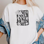 Classic white T-shirt with bold black typography reading “Not Enough Sage For This Shit,” accented with illustrated sage leaves, sparkles, and a small potion jar with a leafy design. Playful and cheeky statement shirt for spiritual, witchy, or humor-loving personalities.