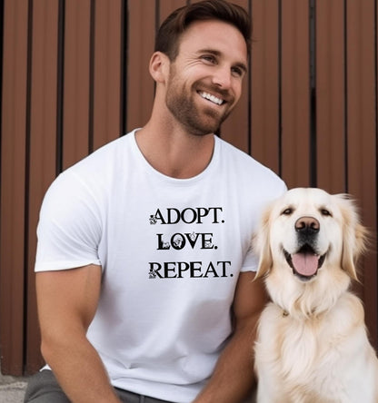 Adopt. Love. Repeat. T-shirt featuring bold black text with small puppy and kitten accents incorporated into the letters. Printed on a classic white unisex tee, this design is perfect for pet lovers, rescue advocates, and animal adoption supporters. Ideal for wearing to adoption events, volunteering at shelters, or showing pride in giving animals a forever home.