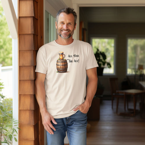 Ivory T-shirt with a Renaissance Faire-inspired design featuring a wooden ale barrel topped with a frothy mug of beer and the phrase “All Hail The Ale!” in medieval-style lettering. A fun and festive shirt perfect for fair lovers, pub crawls, and anyone who enjoys the lively spirit of ale and medieval celebrations.