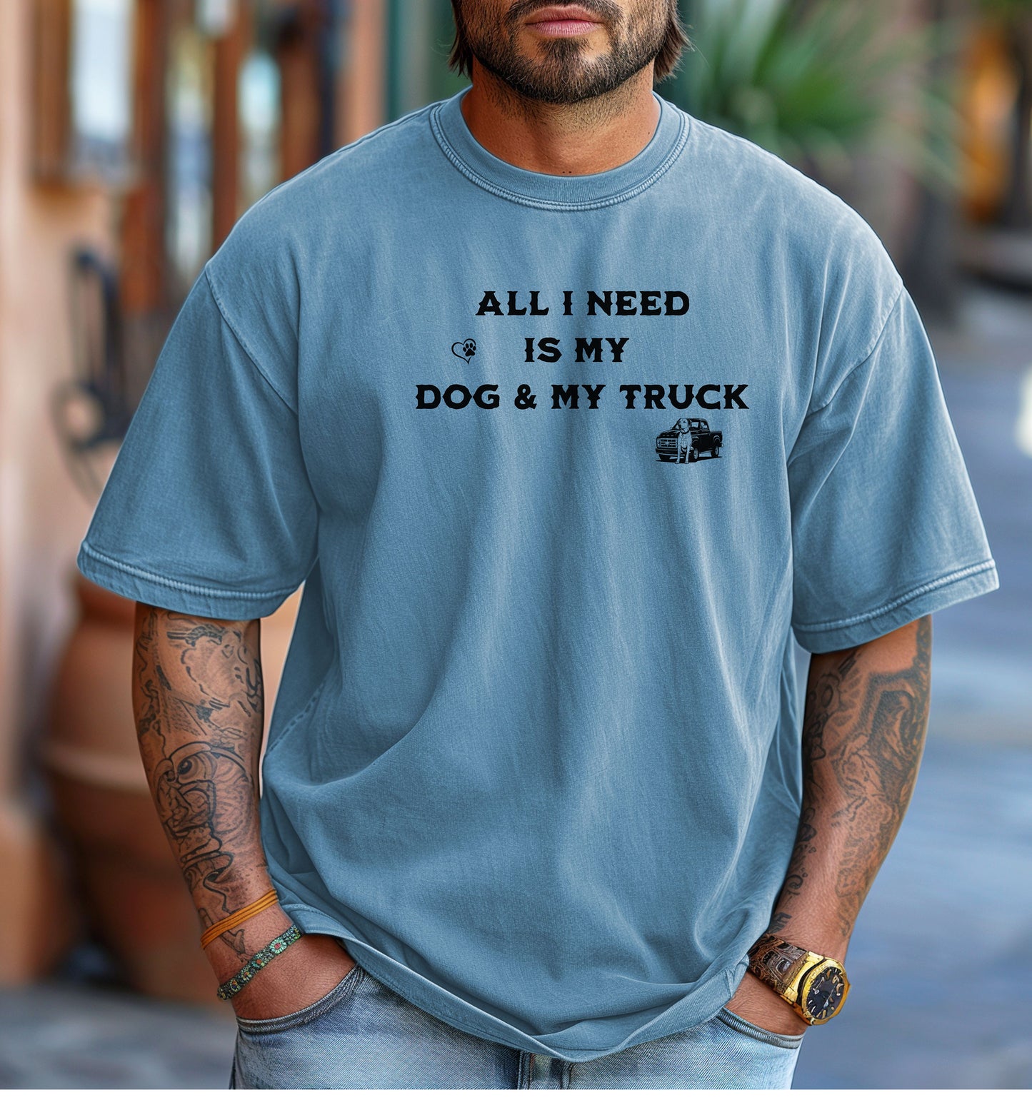 All I Need is My Dog & My Truck T-shirt featuring bold black text with small graphic icons of a paw print heart and a pickup truck. Printed on a washed denim unisex tee, this casual design is perfect for dog lovers and truck enthusiasts who embrace a laid-back, country lifestyle. Ideal for everyday wear, gifting, or showing off two favorite passions—dogs and trucks.
