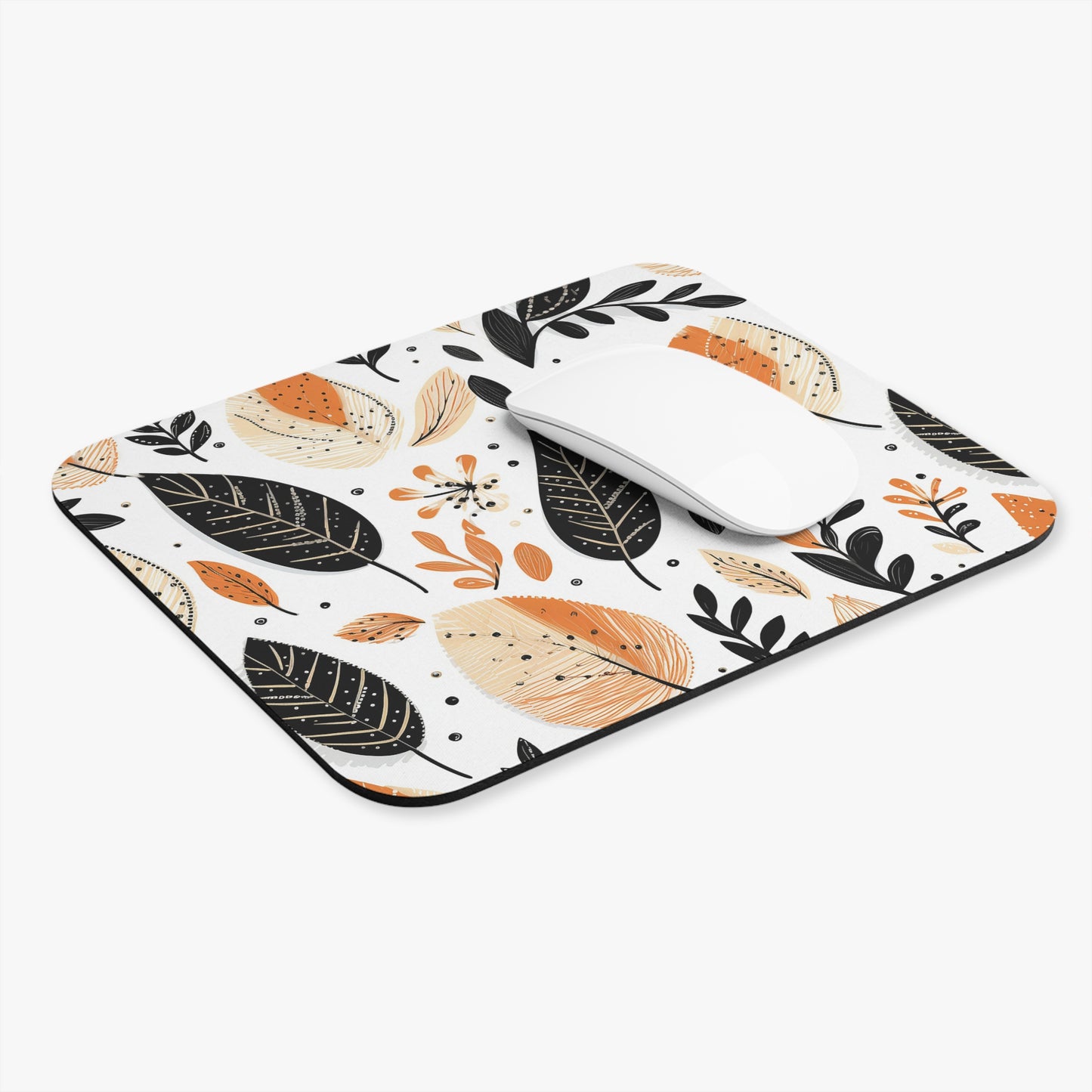 Mouse pad with leaf pattern on a white background with a wireless mouse