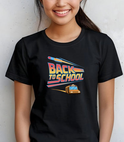 Youth wearing a black t-shirt with a bold “Back to School” design featuring retro-style typography, a large pencil graphic above the text, and a yellow school bus driving below. A fun and colorful tee perfect for celebrating the new school year with energy and excitement.