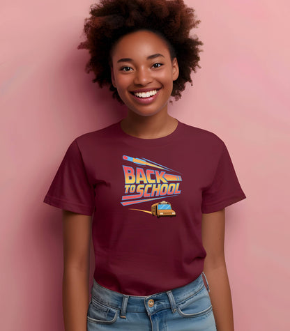 Youth wearing a Maroon t-shirt with a bold “Back to School” design featuring retro-style typography, a large pencil graphic above the text, and a yellow school bus driving below. A fun and colorful tee perfect for celebrating the new school year with energy and excitement.