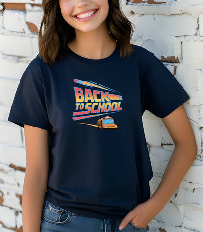 Youth wearing a navy t-shirt with a bold “Back to School” design featuring retro-style typography, a large pencil graphic above the text, and a yellow school bus driving below. A fun and colorful tee perfect for celebrating the new school year with energy and excitement.