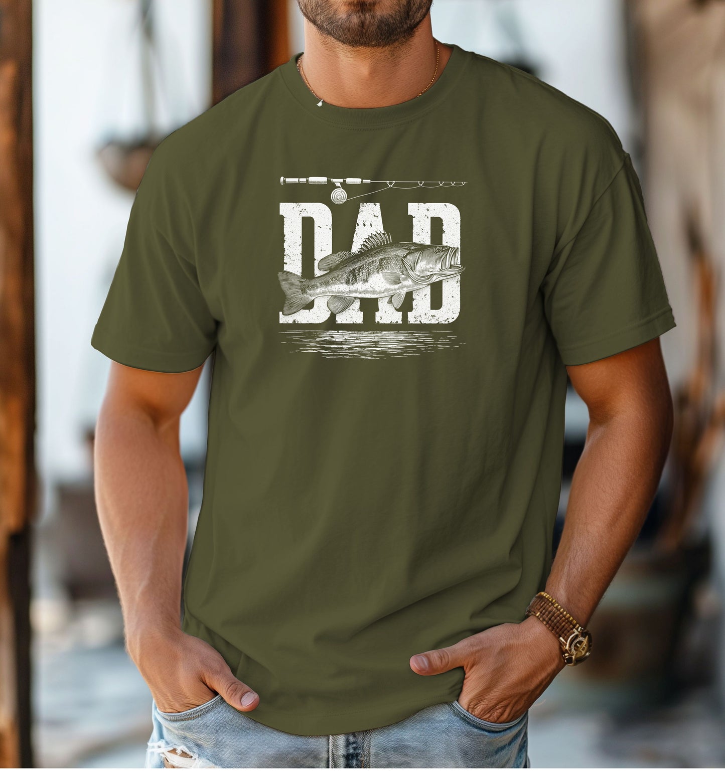 Bass Fishing Dad T-shirt featuring the word 'DAD' in bold, distressed white lettering with a detailed bass fish illustration overlaying the text. A fishing rod graphic runs above the design, with subtle water ripple details below. Printed on a hemp color unisex tee, this shirt is perfect for dads who love fishing, making it an ideal gift for Father’s Day, birthdays, or weekend fishing trips.