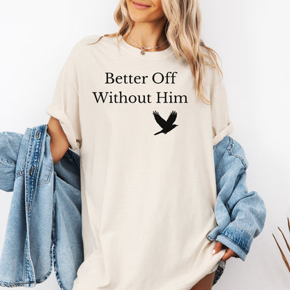 Ivory T-shirt with the bold black phrase "Better Off Without Him" printed in a clean serif font, featuring a simple silhouette of a flying black bird that symbolizes freedom and transformation beneath the text. 