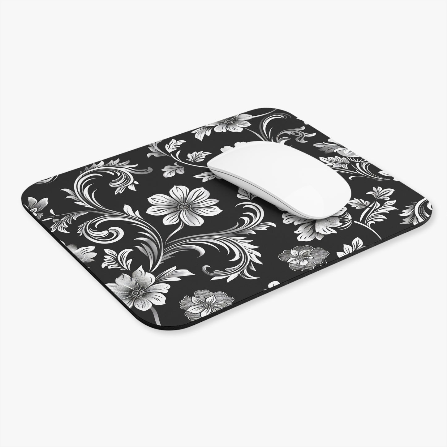 Floral black and white mouse pad with a white mouse on a white background