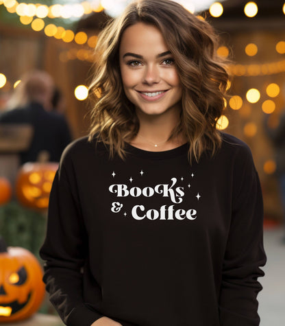 Black Gildan sweatshirt featuring a stylish black “Books & Coffee” design in whimsical lettering, accented with small sparkle icons. A cozy and charming look for bookworms and coffee lovers who enjoy slow mornings, warm drinks, and quiet reading time. Perfect for relaxed, literary-inspired outfits.