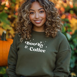 Military Green Gildan sweatshirt featuring a stylish black “Books & Coffee” design in whimsical lettering, accented with small sparkle icons. A cozy and charming look for bookworms and coffee lovers who enjoy slow mornings, warm drinks, and quiet reading time. Perfect for relaxed, literary-inspired outfits.