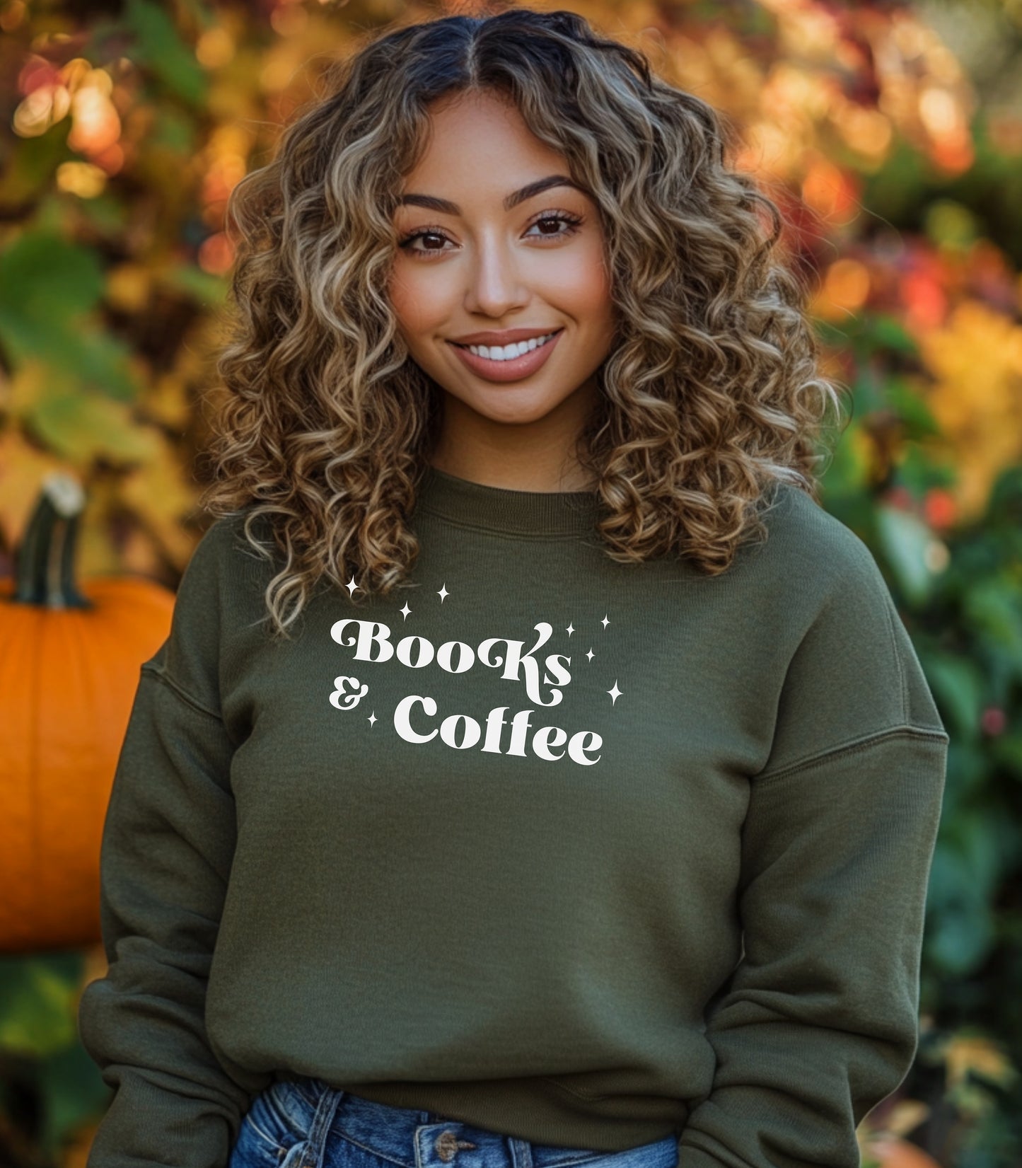 Military Green Gildan sweatshirt featuring a stylish black “Books & Coffee” design in whimsical lettering, accented with small sparkle icons. A cozy and charming look for bookworms and coffee lovers who enjoy slow mornings, warm drinks, and quiet reading time. Perfect for relaxed, literary-inspired outfits.