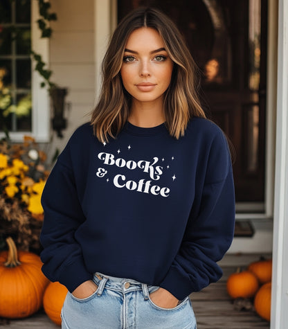 Navy Gildan sweatshirt featuring a stylish black “Books & Coffee” design in whimsical lettering, accented with small sparkle icons. A cozy and charming look for bookworms and coffee lovers who enjoy slow mornings, warm drinks, and quiet reading time. Perfect for relaxed, literary-inspired outfits.