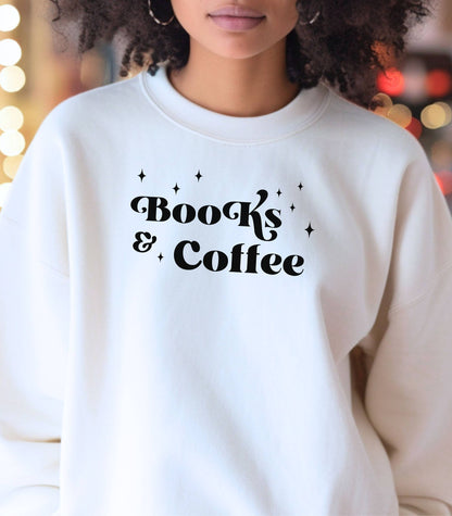 White Gildan sweatshirt featuring a stylish black “Books & Coffee” design in whimsical lettering, accented with small sparkle icons. A cozy and charming look for bookworms and coffee lovers who enjoy slow mornings, warm drinks, and quiet reading time. Perfect for relaxed, literary-inspired outfits.