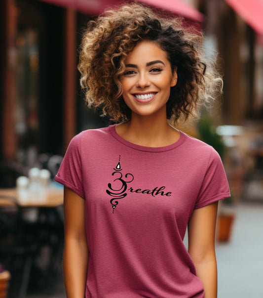 Breathe in Sanskrit T-shirt featuring an elegant black Sanskrit-inspired symbol integrated with the word 'Breathe' in flowing script. Printed on a soft, short-sleeve heather raspberry unisex tee, this calming design promotes mindfulness and relaxation. Perfect for yoga enthusiasts, meditation practitioners, and anyone embracing a peaceful, intentional lifestyle.