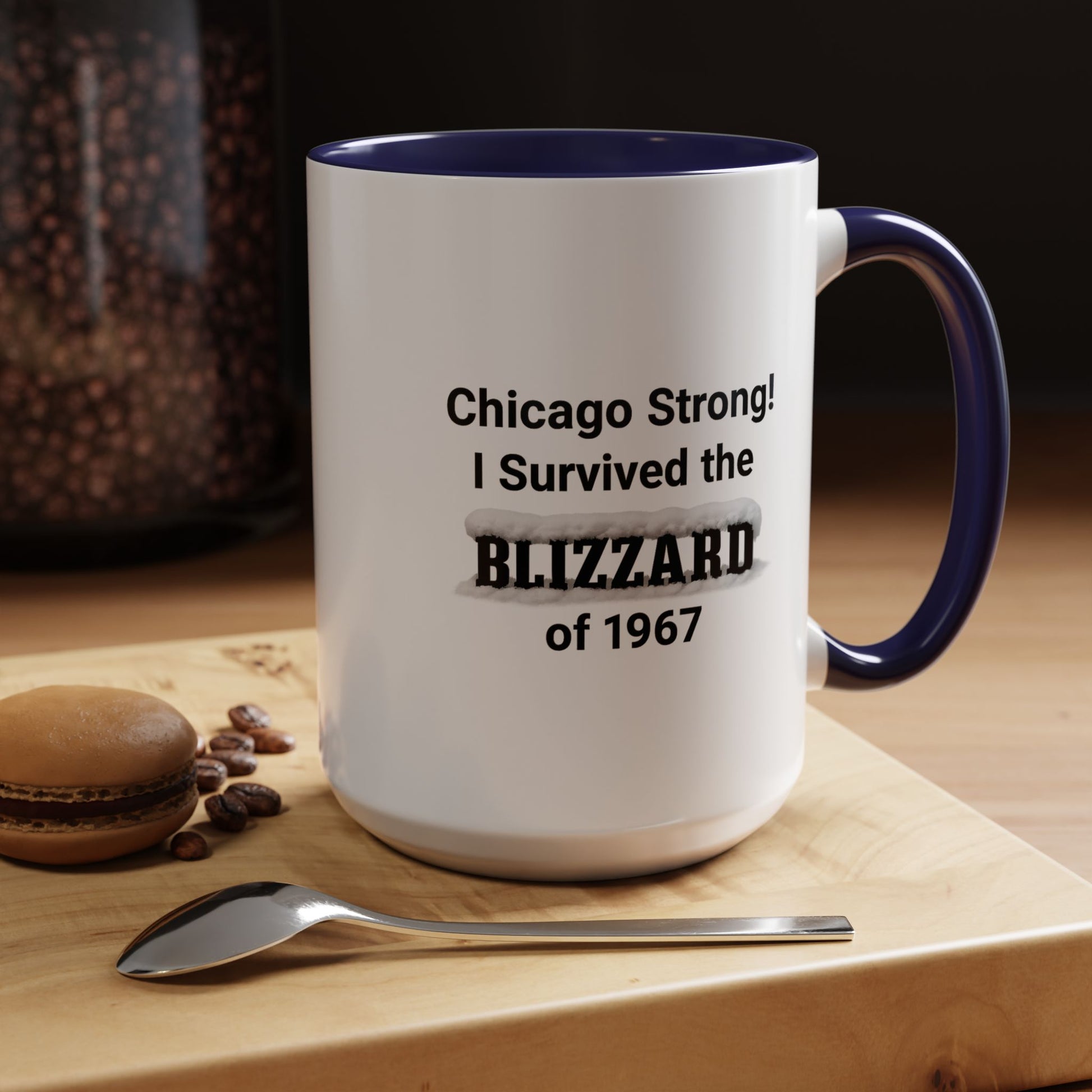 Mug with 'Chicago Strong! I Survived the Blizzard of 1967' text on a wooden surface with coffee beans and a spoon.