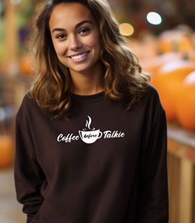 Black Gildan sweatshirt with a centered white graphic of a steaming coffee cup and stylish text reading “Coffee before Talkie.” The playful design humorously declares the need for caffeine before conversation—perfect for coffee lovers who enjoy cozy comfort and a touch of sass in their morning routine.