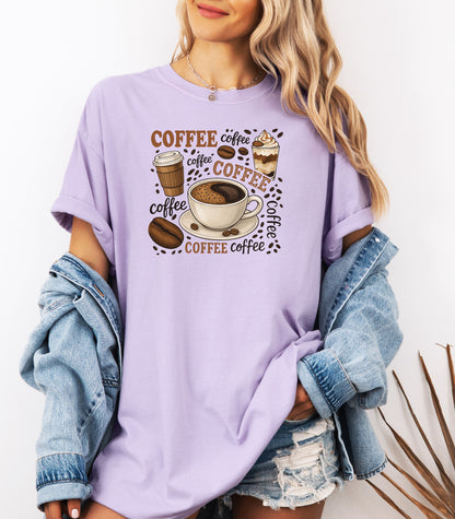 Orchid t-shirt featuring a playful coffee-themed design with multiple illustrated coffee cups, beans, and the word “coffee” repeated in various fonts and styles. Centered around a steaming cup of coffee on a saucer, this fun and cozy graphic is perfect for caffeine lovers who want to show off their coffee obsession in style.