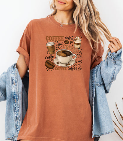 Yam t-shirt featuring a playful coffee-themed design with multiple illustrated coffee cups, beans, and the word “coffee” repeated in various fonts and styles. Centered around a steaming cup of coffee on a saucer, this fun and cozy graphic is perfect for caffeine lovers who want to show off their coffee obsession in style.
