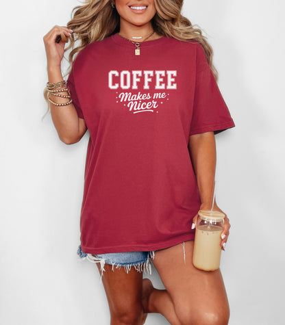 Graphic Chili t-shirt design featuring bold varsity-style white text “COFFEE” with the phrase “makes me nicer” in a playful script underneath, surrounded by small stars. A fun and relatable design perfect for coffee lovers who know their mood improves with caffeine—ideal for casual wear with a humorous twist.