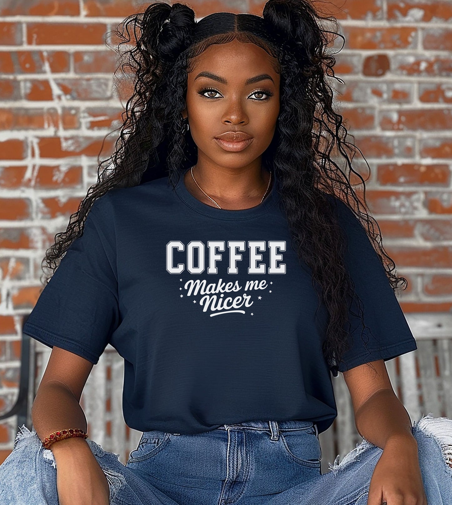 Graphic True Navy t-shirt design featuring bold varsity-style white text “COFFEE” with the phrase “makes me nicer” in a playful script underneath, surrounded by small stars. A fun and relatable design perfect for coffee lovers who know their mood improves with caffeine—ideal for casual wear with a humorous twist.