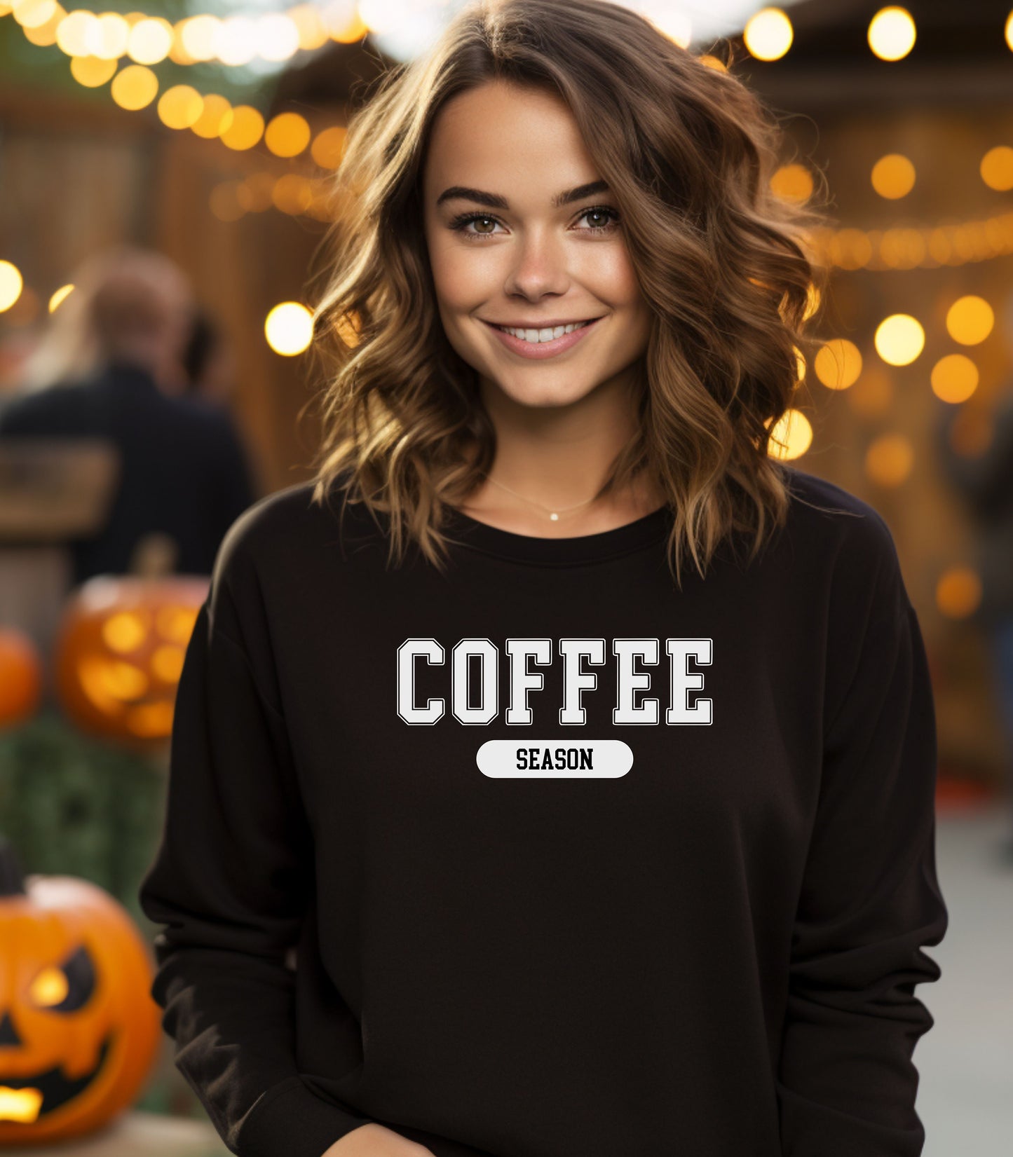 Black sweatshirt featuring a bold “COFFEE” design in varsity-style white lettering with the word “SEASON” underneath in a rounded black label. A cozy and stylish look perfect for coffee lovers embracing their favorite time of year—whether it’s fall, winter, or every season.
