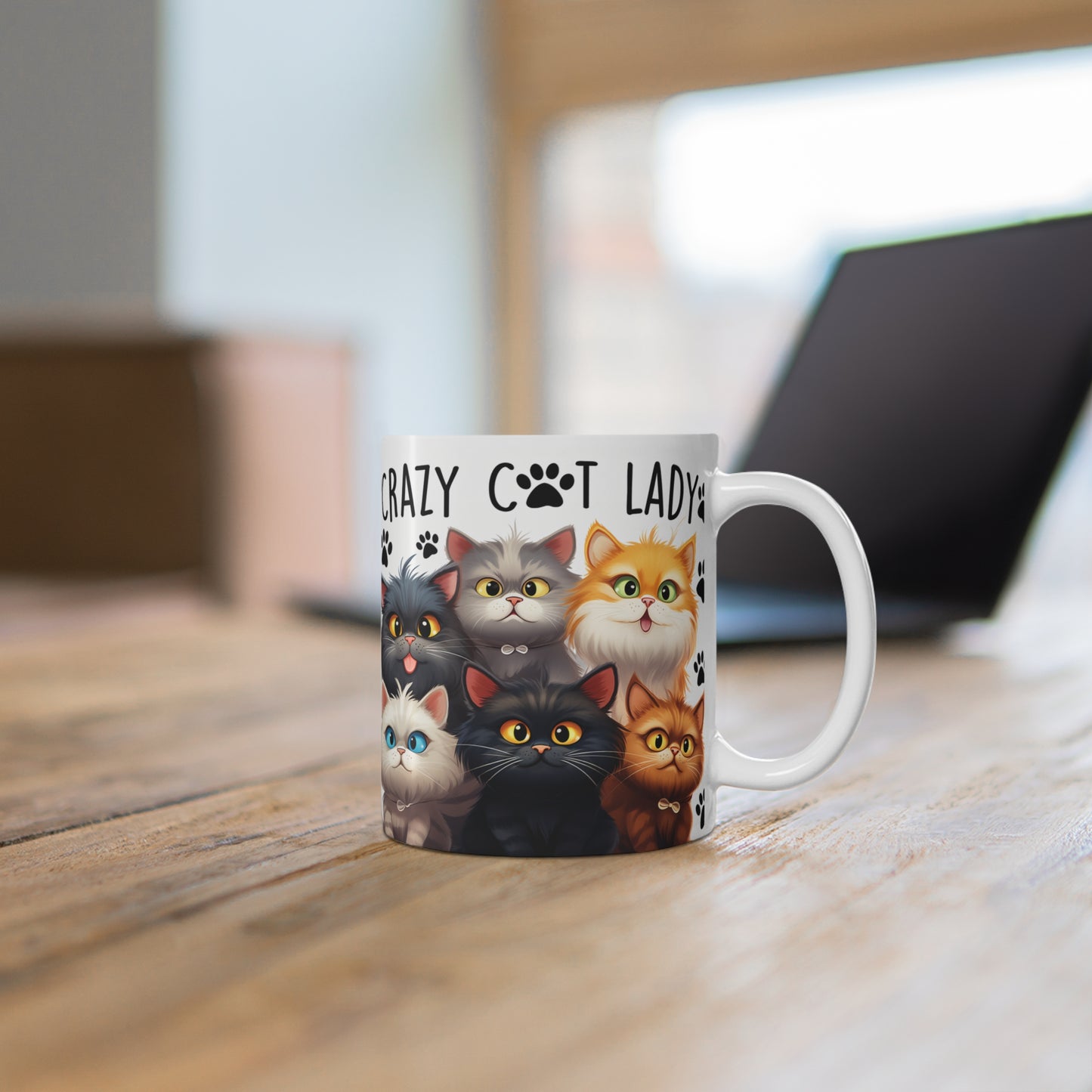 Ceramic Mug with cat illustrations and 'Crazy Cat Lady' text on a wooden surface.