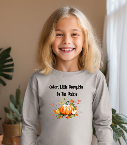 Older Toddler wearing a Heather long sleeve shirt with 'Cutest Little Pumpkin In The Patch' text and pumpkin graphics.