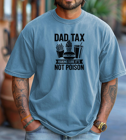 Dad Tax T-shirt featuring the humorous phrase 'Dad Tax – Making Sure It’s Not Poison' with graphics of fries, a burger, ice cream, and a drink. Printed on a washed denim unisex tee, this playful design is perfect for dads who jokingly 'sample' their kids’ food. Ideal for Father’s Day, casual wear, or gifting to food-loving fathers with a great sense of humor.