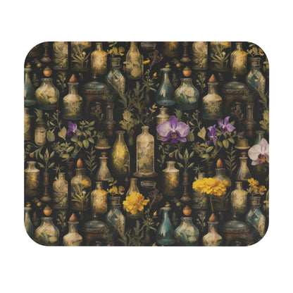 Mouse pad with decorative design of apothecary bottles and flowers on a dark background