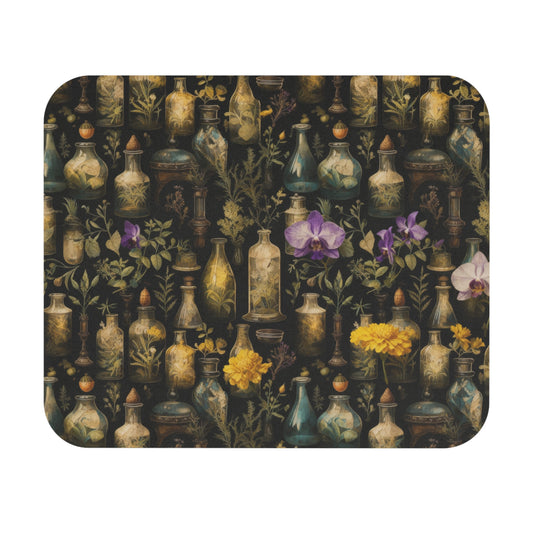 Mouse pad with decorative design of apothecary bottles and flowers on a dark background