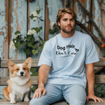 A person wearing a baby blue T-shirt with the playful black text “Dog Hair, Don’t Care” and a paw print accent. The design embraces the humor and love of dog ownership, making it a perfect casual fashion statement for pet lovers who proudly accept furry companionship.