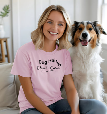 A person wearing a pink T-shirt with the playful black text “Dog Hair, Don’t Care” and a paw print accent. The design embraces the humor and love of dog ownership, making it a perfect casual fashion statement for pet lovers who proudly accept furry companionship.