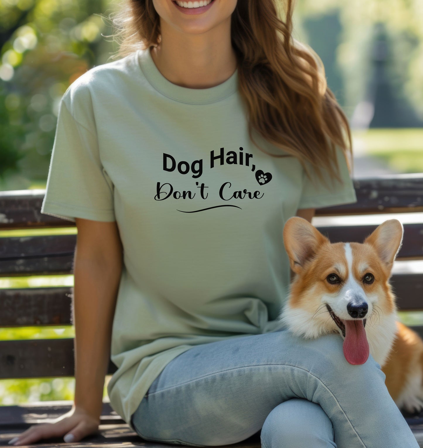 A person wearing a sage T-shirt with the playful black text “Dog Hair, Don’t Care” and a paw print accent. The design embraces the humor and love of dog ownership, making it a perfect casual fashion statement for pet lovers who proudly accept furry companionship.