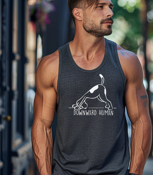 Downward Human tank top featuring a playful design of a dog doing a yoga pose, mimicking the popular downward dog position. The humorous graphic includes the text 'Downward Human,' making it perfect for dog lovers and yoga enthusiasts. Printed on a soft, lightweight dark grey tank, this fun and casual design blends fitness and pet humor, ideal for workouts, lounging, or outdoor activities.