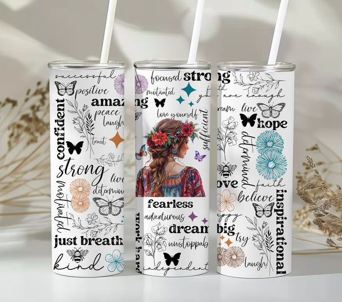 Empowering Motivational Skinny Tumbler – 20 oz featuring an artistic design with a woman adorned in a floral crown on the back and surrounded by uplifting words like strong, fearless, confident, love, believe, and inspirational. Accented with butterflies, bees, and flowers, this reusable stainless steel tumbler is perfect for keeping drinks hot or cold while inspiring positivity and self-confidence every day.