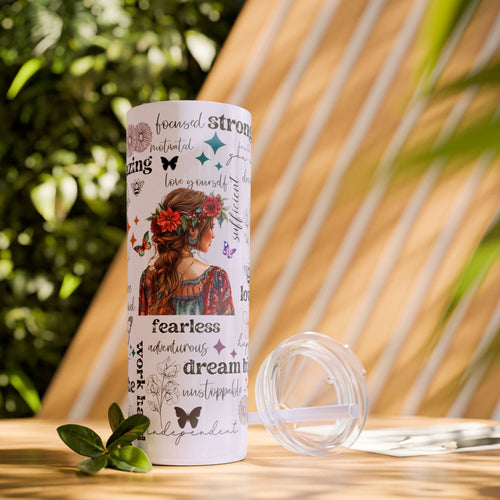 Empowering Motivational Skinny Tumbler – 20 oz featuring an artistic design with a woman adorned in a floral crown on the back and surrounded by uplifting words like strong, fearless, confident, love, believe, and inspirational. Accented with butterflies, bees, and flowers, this reusable stainless steel tumbler is perfect for keeping drinks hot or cold while inspiring positivity and self-confidence every day.