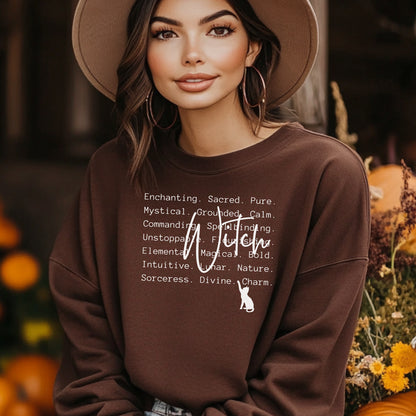 Person wearing a Dark Chocolate sweatshirt with text and a cat graphic, standing outdoors with blurred background