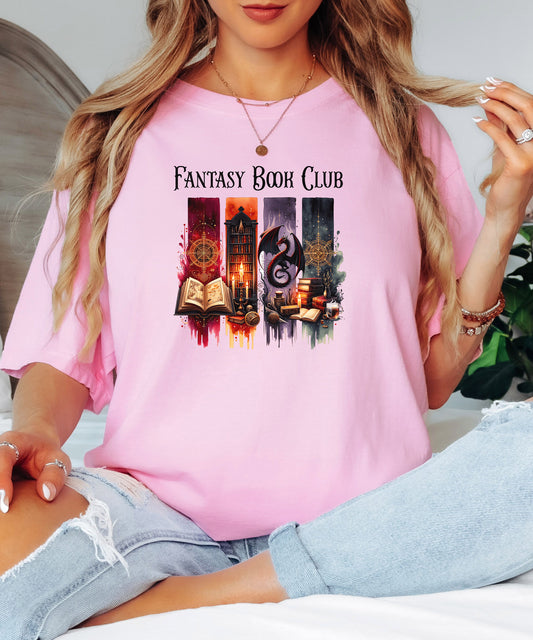 Fantasy-themed t-shirt design featuring four vertical panels with vibrant mystical elements: open spellbooks, candles, magical symbols, ancient tomes, a fierce dragon, and a steaming cup of coffee. Rich tones of red, orange, purple, and blue create an enchanting atmosphere—perfect for fantasy book lovers, magic fans, and mystical minds.