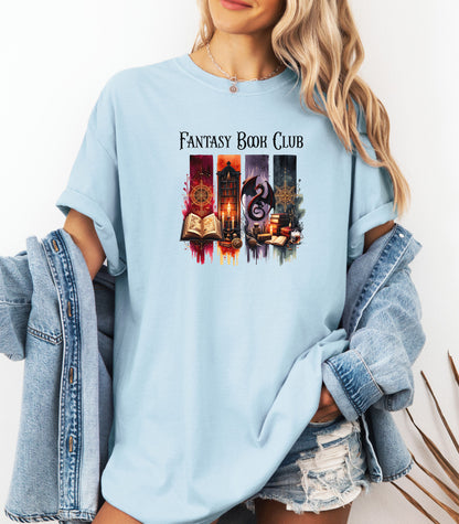 Fantasy-themed t-shirt design featuring four vertical panels with vibrant mystical elements: open spellbooks, candles, magical symbols, ancient tomes, a fierce dragon, and a steaming cup of coffee. Rich tones of red, orange, purple, and blue create an enchanting atmosphere—perfect for fantasy book lovers, magic fans, and mystical minds.