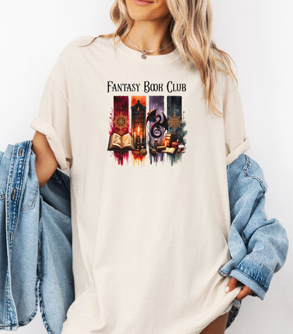 Fantasy-themed t-shirt design featuring four vertical panels with vibrant mystical elements: open spellbooks, candles, magical symbols, ancient tomes, a fierce dragon, and a steaming cup of coffee. Rich tones of red, orange, purple, and blue create an enchanting atmosphere—perfect for fantasy book lovers, magic fans, and mystical minds.