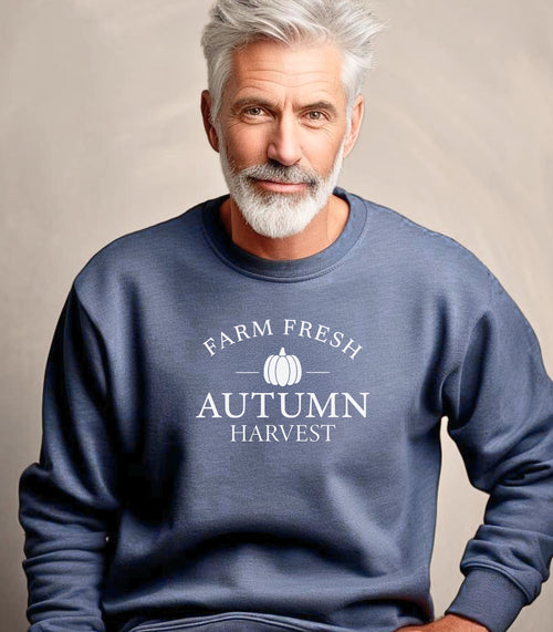 Heather Sport Dark Navy Gildan sweatshirt featuring a minimalist white “Farm Fresh Autumn Harvest” design with a simple pumpkin graphic in the center. A clean and classic fall look that captures rustic charm and seasonal spirit—perfect for farmers' markets, pumpkin patches, and cozy autumn days.