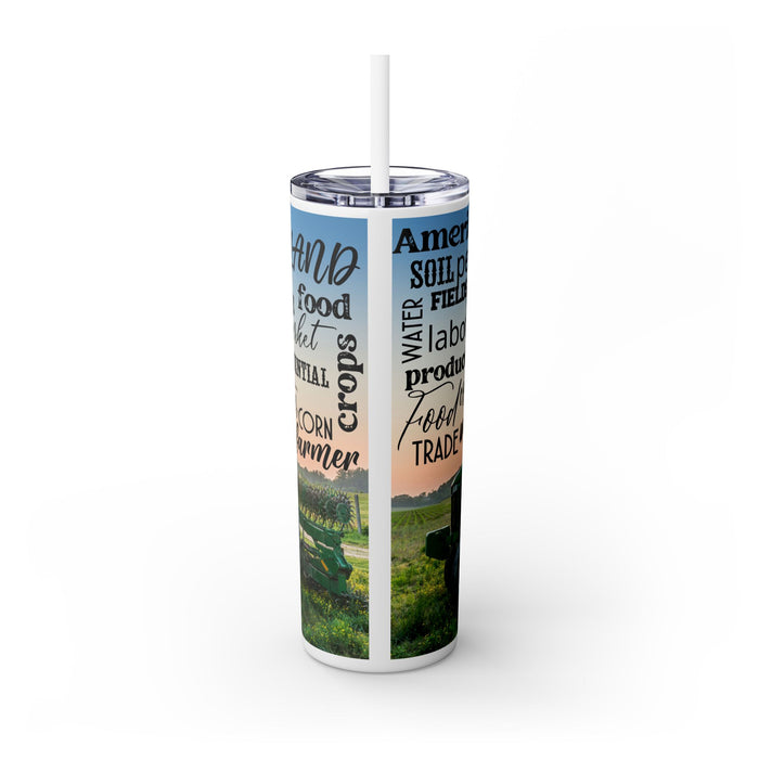 Farm Life Skinny Tumbler – 20 oz featuring a rustic farm scene with a green tractor in a field at sunrise and a background of farming-related words like soil, crops, harvest, land, produce, and hard work. This durable stainless steel tumbler celebrates the farming lifestyle and rural heritage, perfect for keeping drinks hot or cold while honoring agriculture and those who work the land.