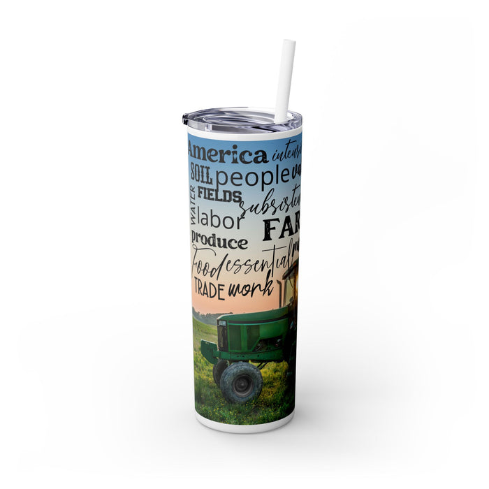 Farm Life Skinny Tumbler – 20 oz featuring a rustic farm scene with a green tractor in a field at sunrise and a background of farming-related words like soil, crops, harvest, land, produce, and hard work. This durable stainless steel tumbler celebrates the farming lifestyle and rural heritage, perfect for keeping drinks hot or cold while honoring agriculture and those who work the land.