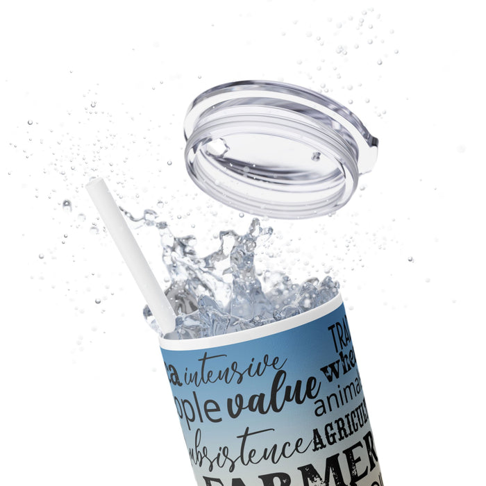 Farm Life Skinny Tumbler – 20 oz featuring a rustic farm scene with a green tractor in a field at sunrise and a background of farming-related words like soil, crops, harvest, land, produce, and hard work. This durable stainless steel tumbler celebrates the farming lifestyle and rural heritage, perfect for keeping drinks hot or cold while honoring agriculture and those who work the land.