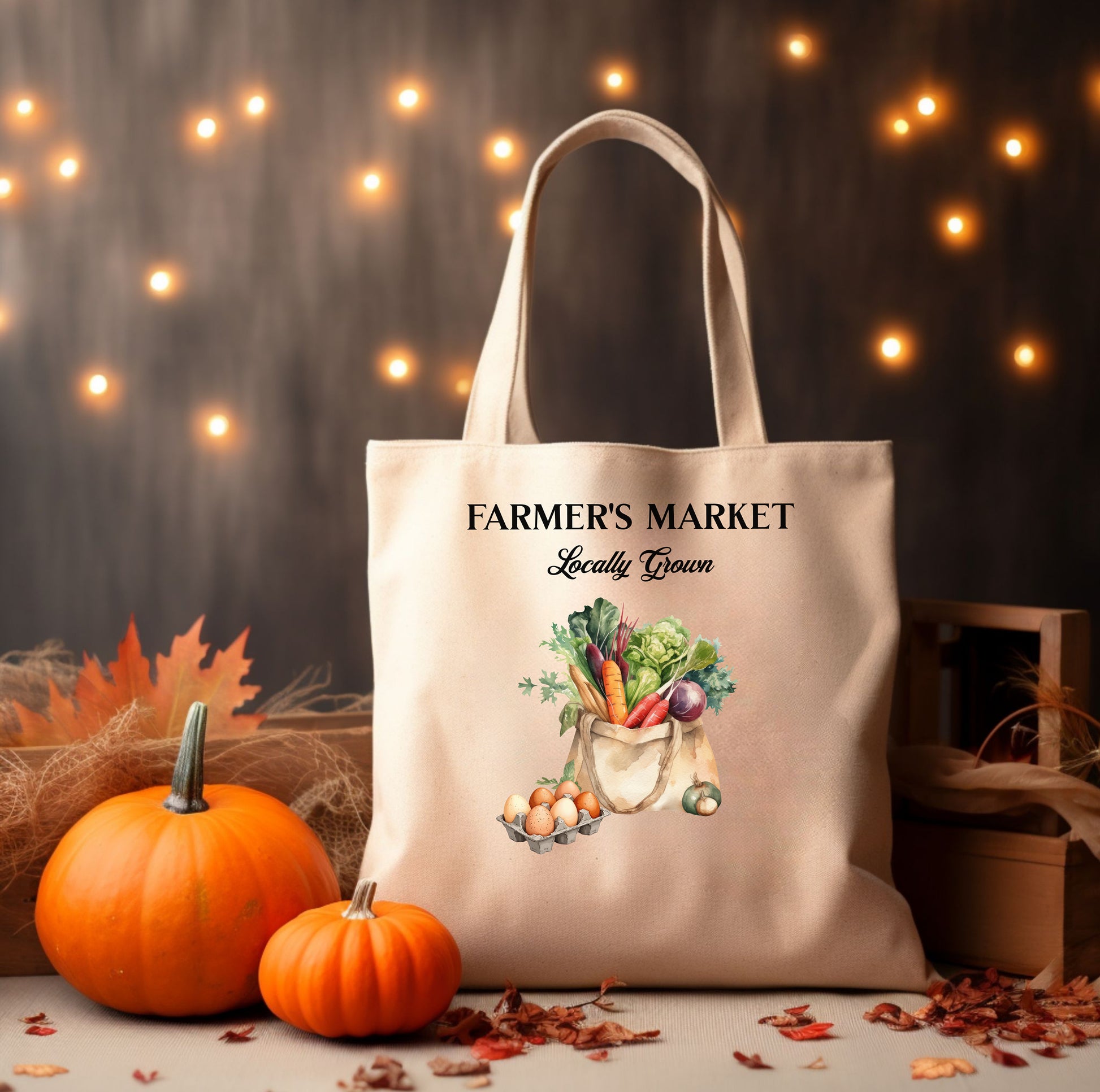 Tote bag with 'Farmer's Market Locally Grown' text and vegetable illustration, surrounded by pumpkins and autumn leaves.
