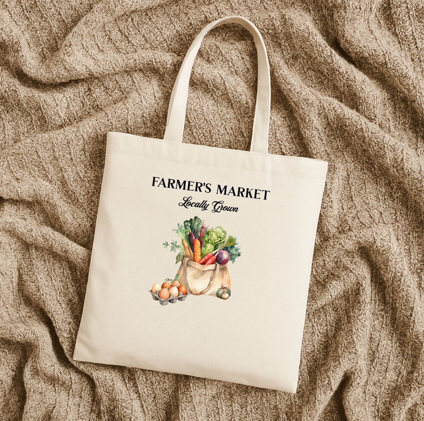 Natural tote bag with 'Farmer's Market Locally Grown' text and vegetable illustration on a textured beige surface