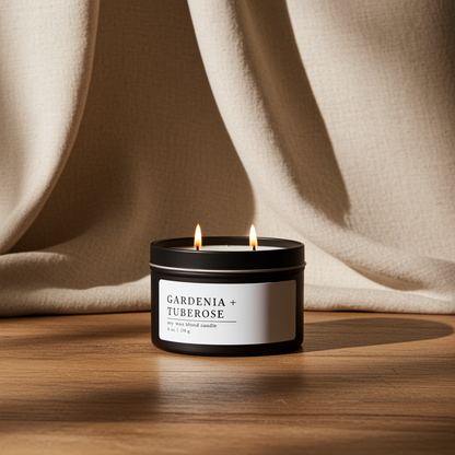 Gardenia + Tuberose soy wax blend candle on a wooden surface with beige fabric in the background