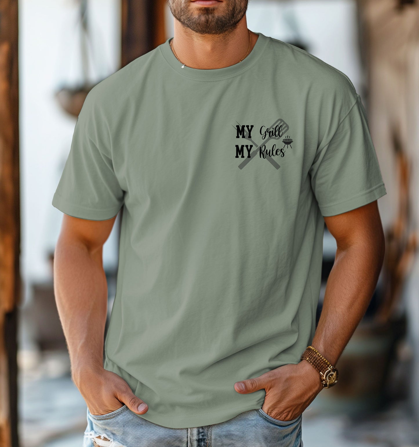 Grill Boss 'My Grill, My Rules' pocket design T-shirt featuring a bold text design with a grilling fork and flame graphic. Printed on a bay light sage unisex tee, this fun and confident design is perfect for BBQ lovers, pitmasters, and backyard chefs who take charge at the grill. Ideal for summer cookouts, Father’s Day, or casual everyday wear.