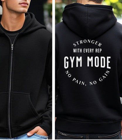 Black Gildan hoodie featuring bold white text on the back: “Stronger with Every Rep” above “GYM MODE,” with “No Pain, No Gain” curved below. A motivational fitness design that inspires dedication and strength, perfect for gym-goers committed to pushing limits and embracing an active lifestyle.