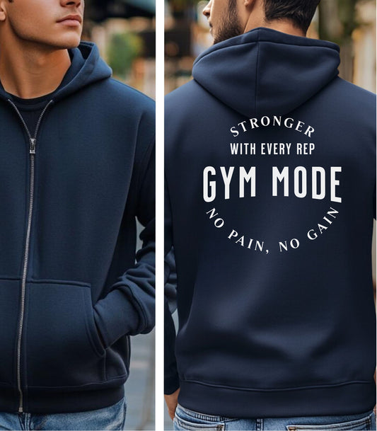 Navy Gildan hoodie featuring bold white text on the back: “Stronger with Every Rep” above “GYM MODE,” with “No Pain, No Gain” curved below. A motivational fitness design that inspires dedication and strength, perfect for gym-goers committed to pushing limits and embracing an active lifestyle.